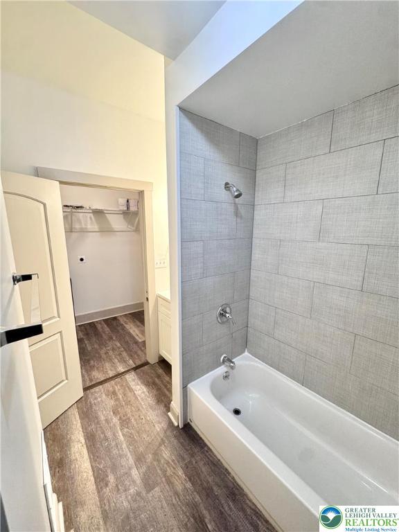 1319 Northampton Street, Unit 1 Easton, PA 18042 - Photo 11 of 12 a bathroom with a tub a sink a window and a shower