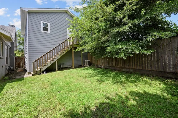 a view of backyard with green space