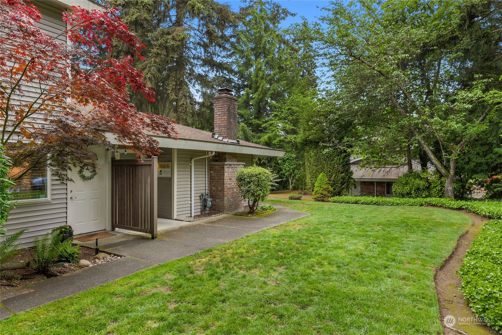 424 214th Street Southwest, Unit 24B Bothell, WA 98021 - Photo 5 of 28 front view of a house with a yard