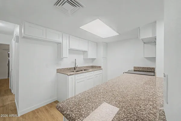 a kitchen with a stove and a refrigerator