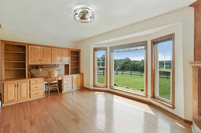 an empty room with windows and closet