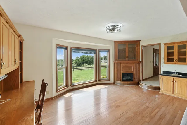 a swimming pool with outdoor seating and yard