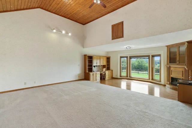 a view of patio with chairs and tables