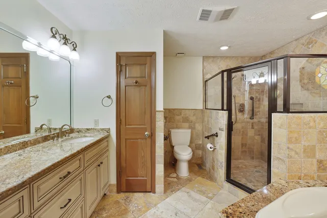 a front view of a house with a garden and porch