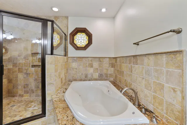 a view of a house with a yard and garage