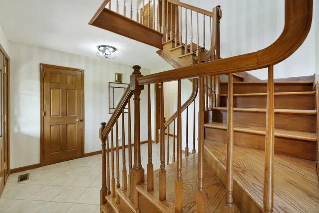 a view of a garden with lawn chairs and a big yard