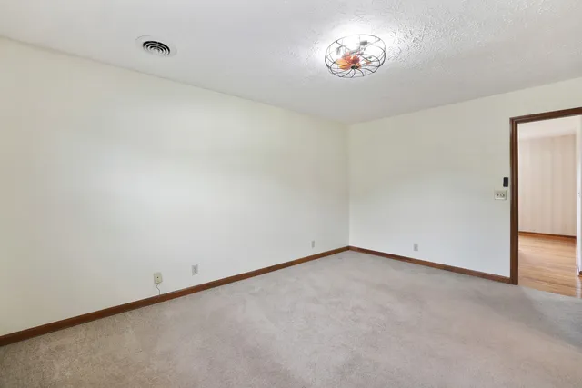 an aerial view of a houses with a yard