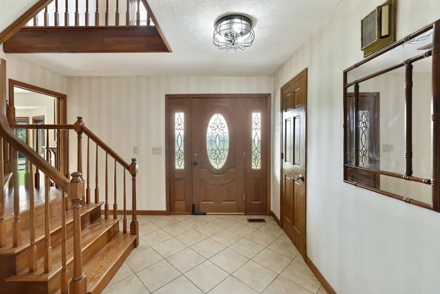 a view of a dining room with furniture and window