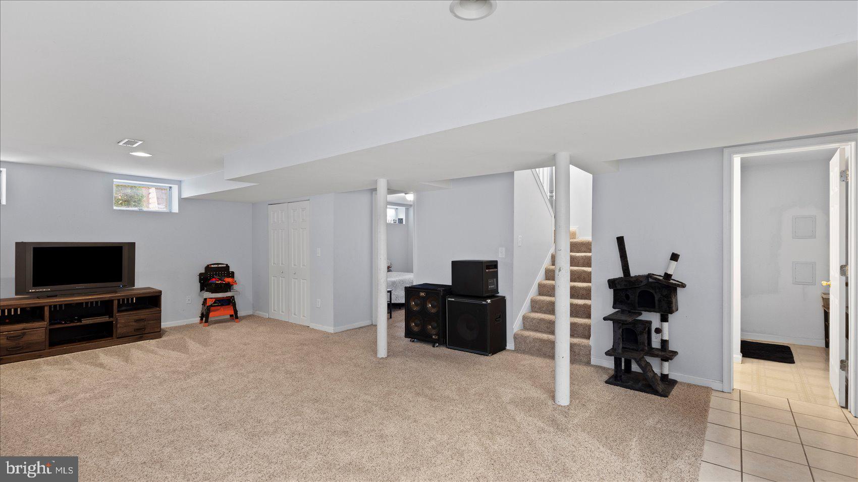 9905 Magledt Road Baltimore, MD 21234 - Photo 17 of 45 a living room with furniture and a flat screen tv