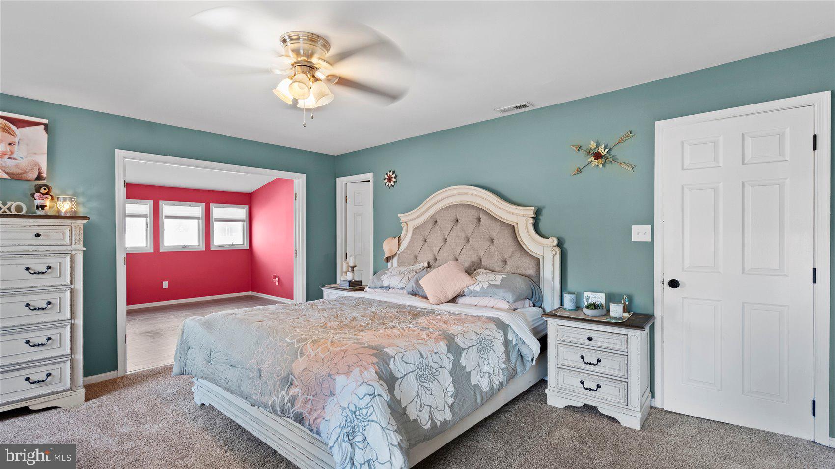 9905 Magledt Road Baltimore, MD 21234 - Photo 23 of 45 a bedroom with a bed and a chandelier