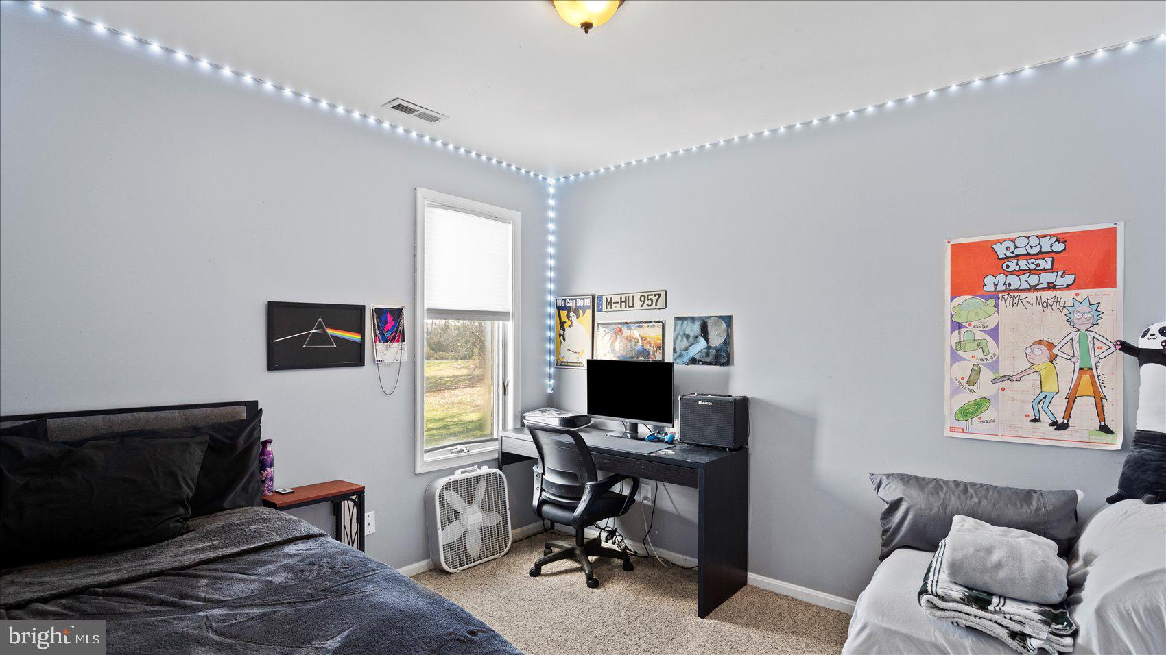 9905 Magledt Road Baltimore, MD 21234 - Photo 28 of 45 a view of a workspace with furniture and a window