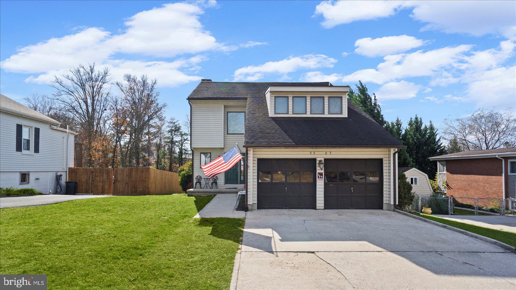 9905 Magledt Road Baltimore, MD 21234 - Photo 4 of 45 a front view of a house with a yard and garage
