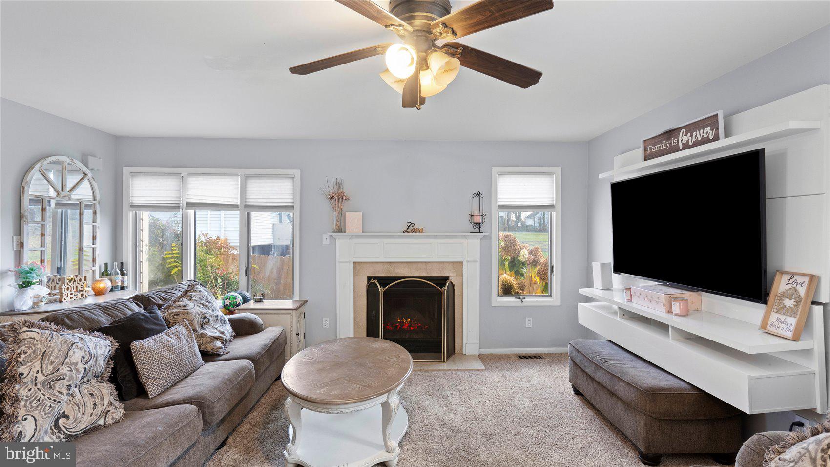 9905 Magledt Road Baltimore, MD 21234 - Photo 6 of 45 a living room with furniture and a flat screen tv