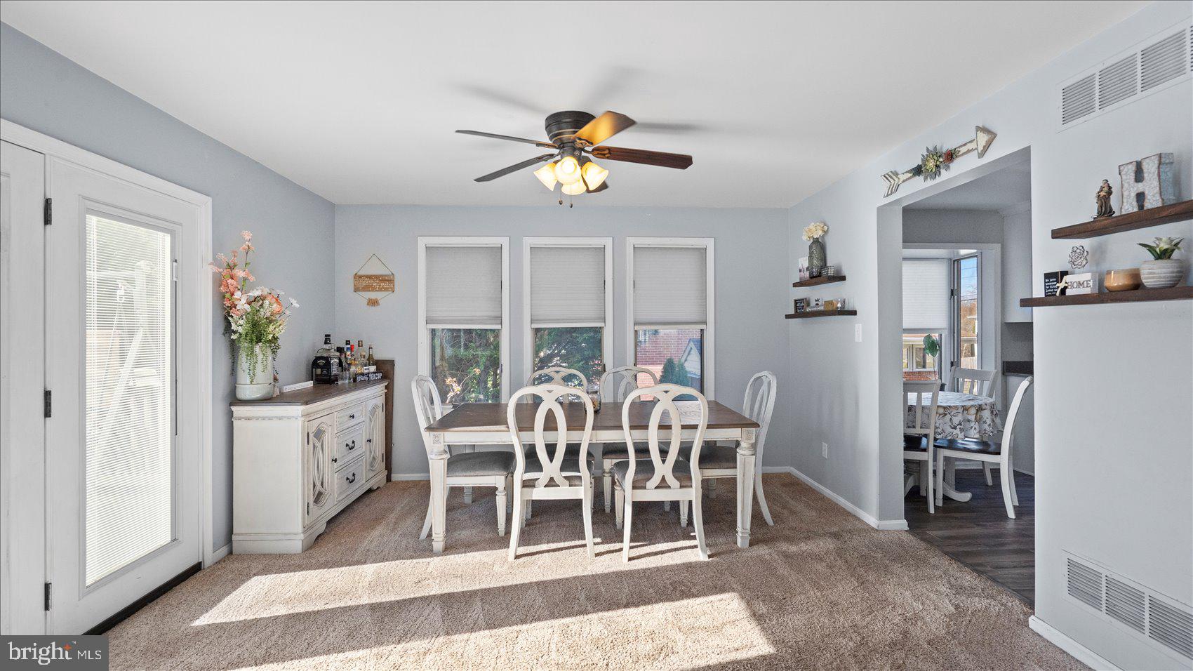 9905 Magledt Road Baltimore, MD 21234 - Photo 8 of 45 a view of a dining room with furniture window and wooden floor