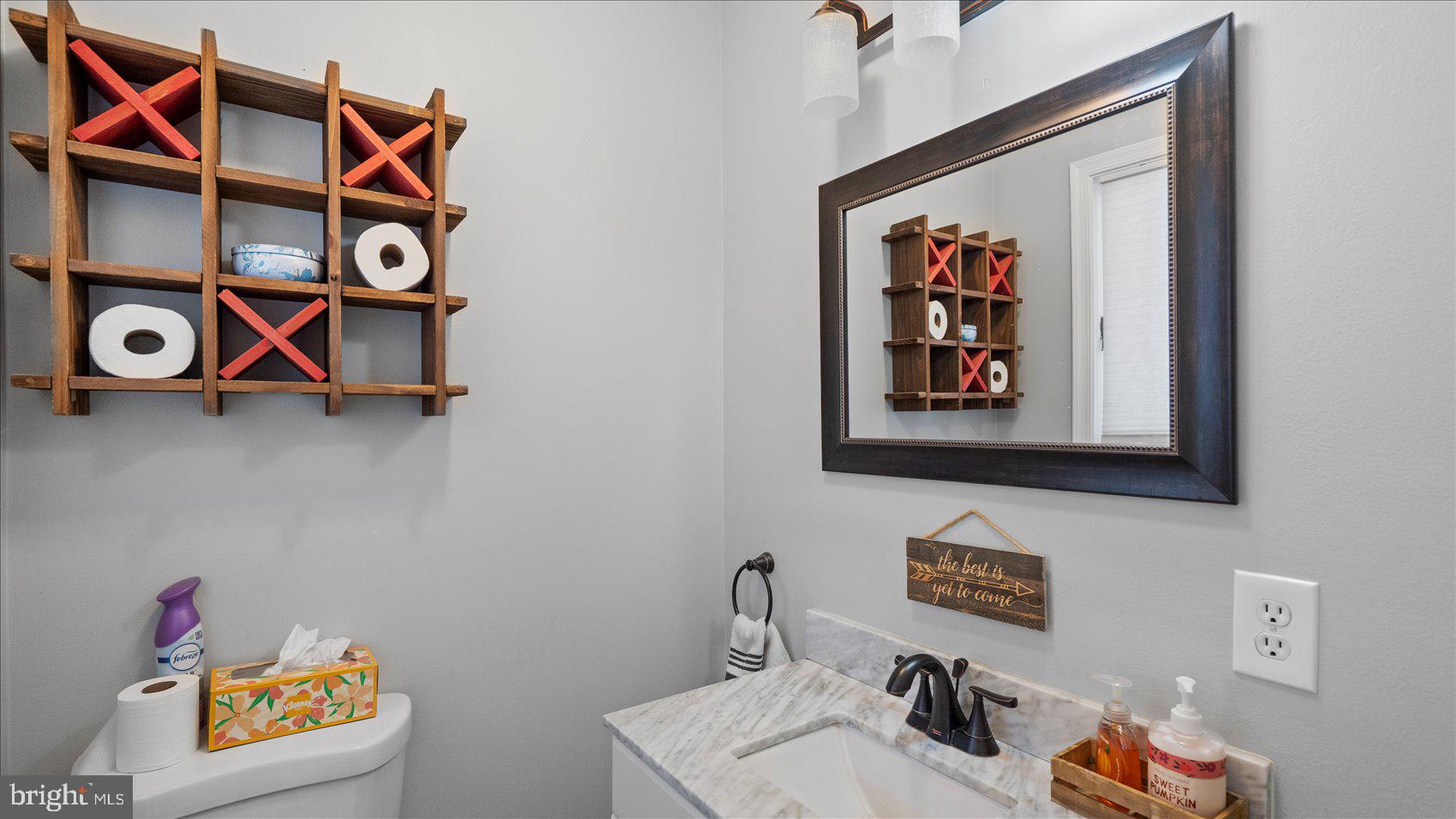 9905 Magledt Road Baltimore, MD 21234 - Photo 10 of 45 a bathroom with a sink and a mirror