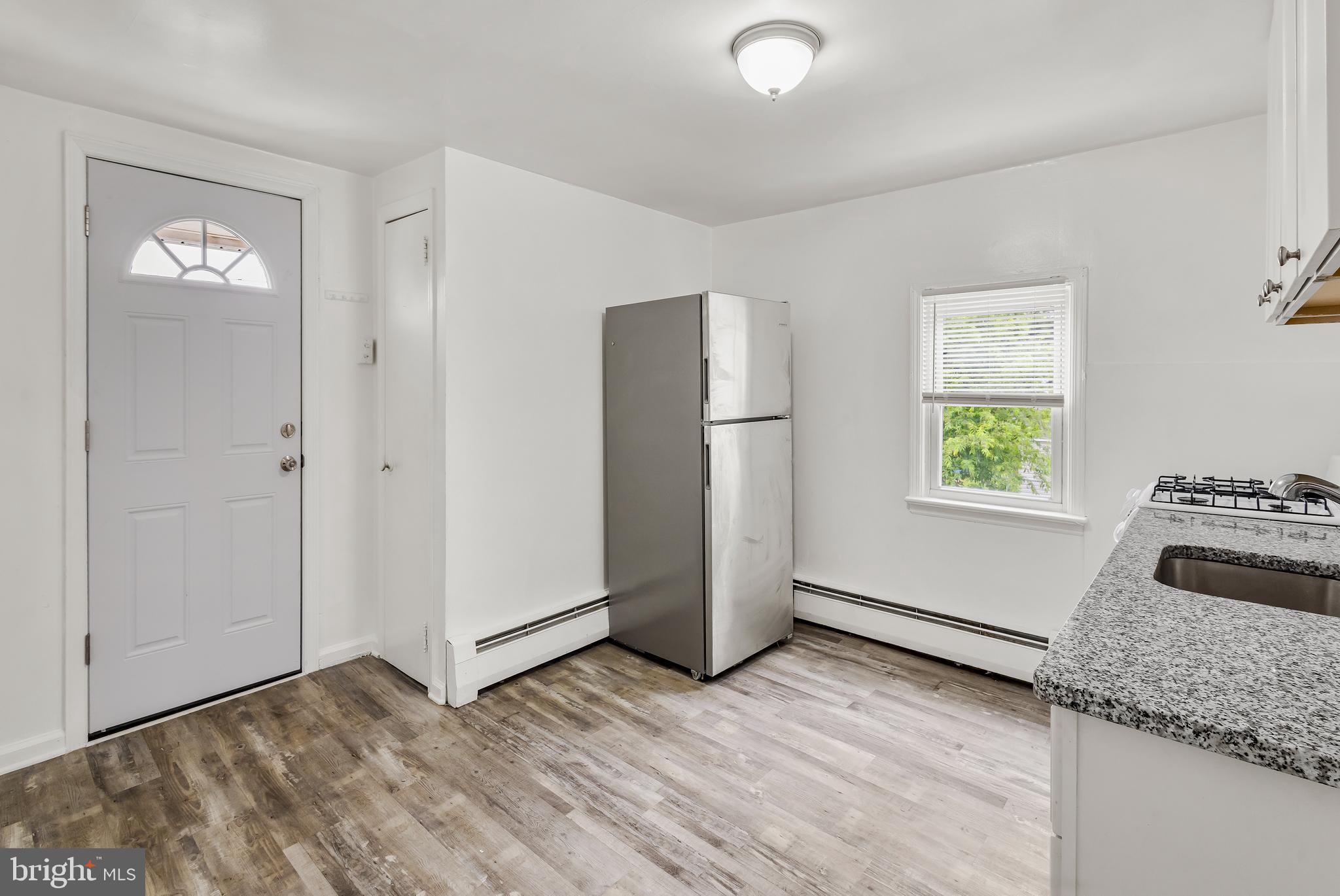 505 West Evesham Road, Unit B Glendora, NJ 08029 - Photo 3 of 10 a kitchen with a refrigerator and window