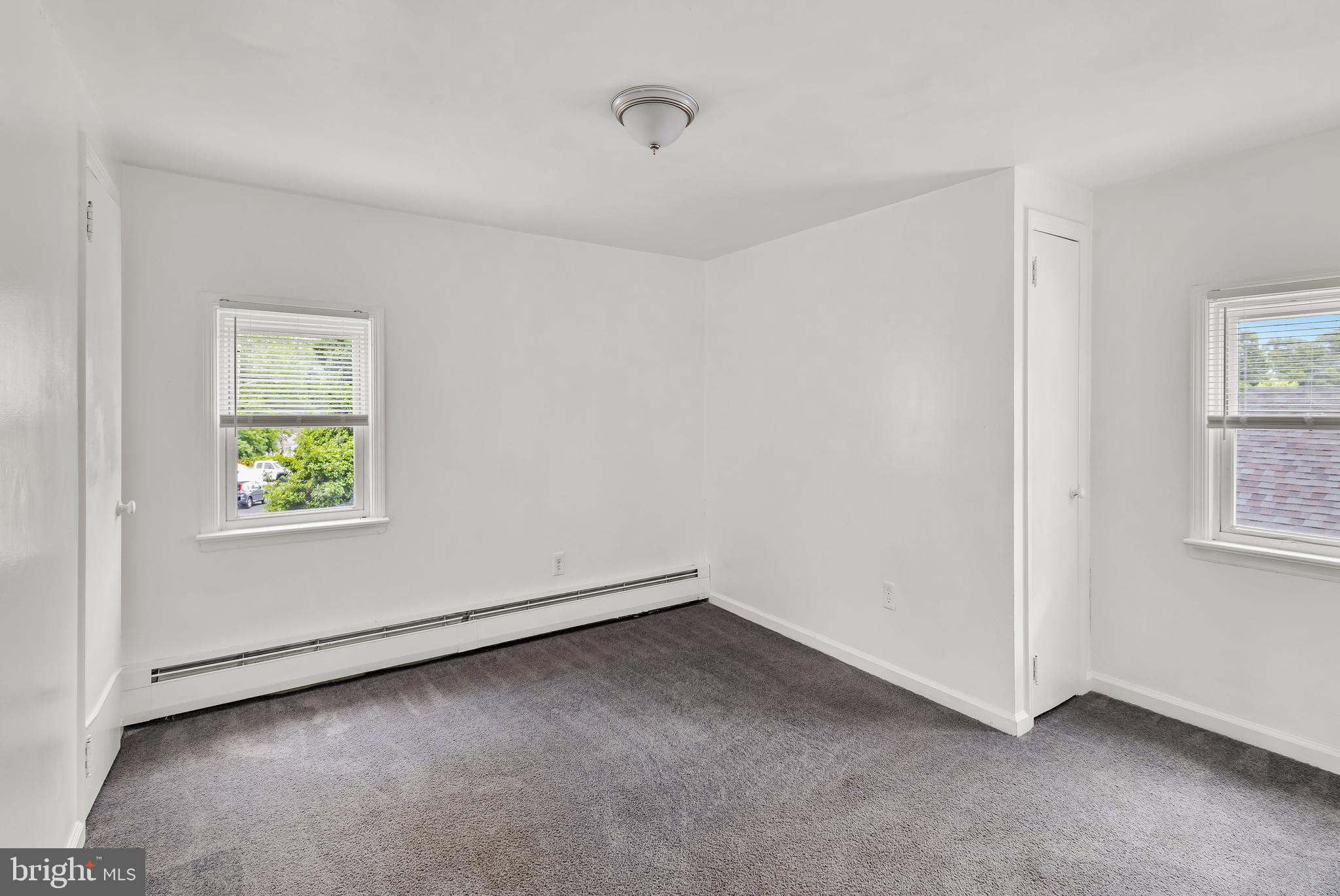 505 West Evesham Road, Unit B Glendora, NJ 08029 - Photo 4 of 10 an empty room with windows