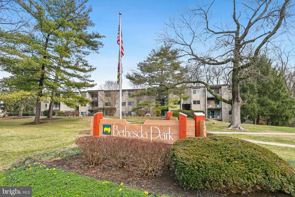 a view of a swimming pool with an outdoor seating