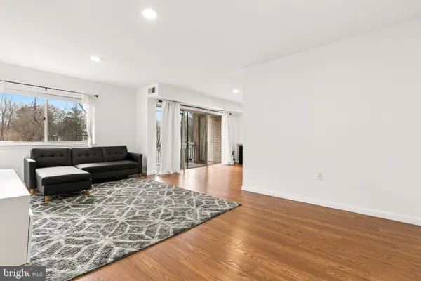 a living room with a couch and a rug