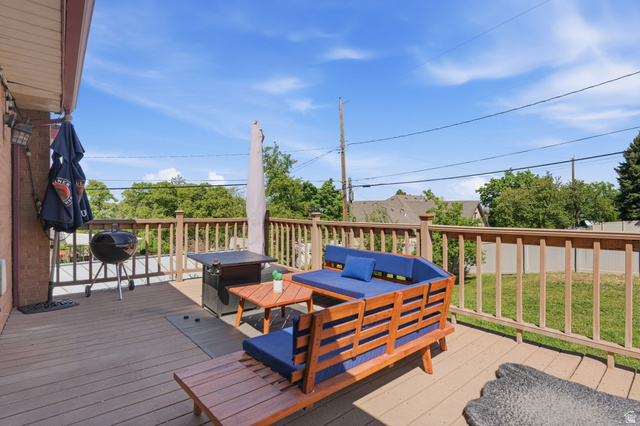 935 900 North Bountiful, UT 84010 - Photo 32 of 46 Wooden terrace with an outdoor lounge area, area for grilling, and a lawn