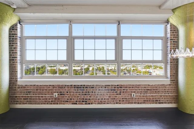 a view of livingroom and kitchen with wooden floor