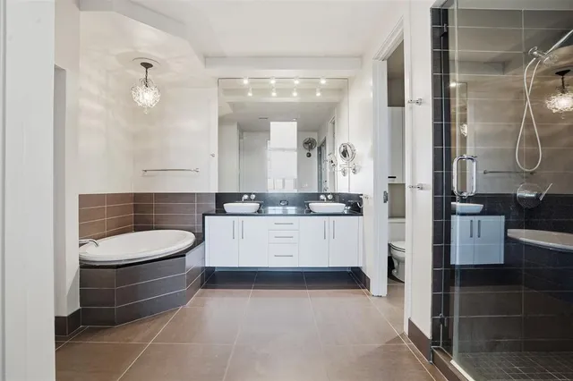 a bathroom with a shower and a sink