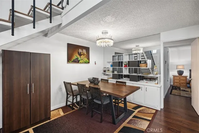 a dining room with wooden floor and breakfast area
