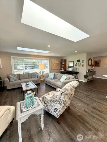 a living room with furniture and a table