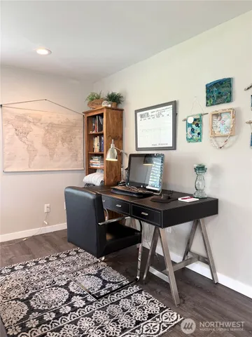 a view of a workspace with furniture