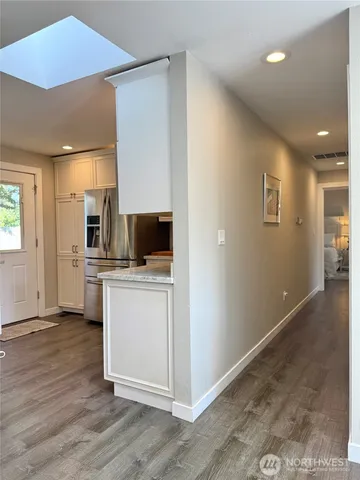 a view of a kitchen cabinets and wooden floor