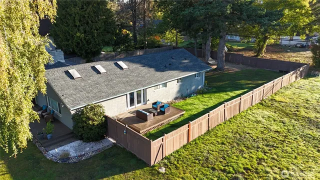 a view of a backyard with chairs