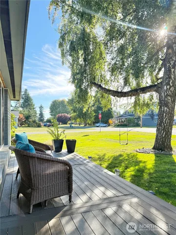 a view of swimming pool with outdoor seating and yard
