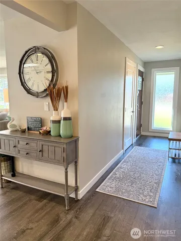 a living room with furniture and a mirror