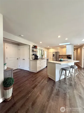 a view of kitchen with cabinets and wooden floor