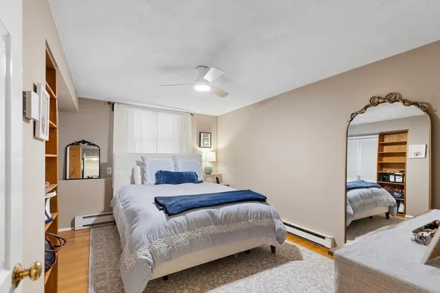 a bedroom with a bed and a view of bedroom