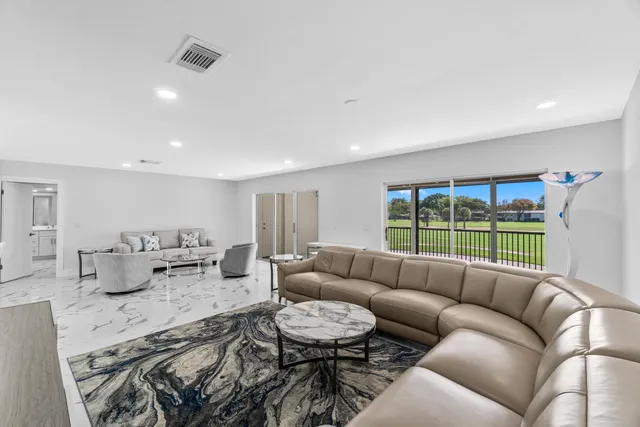 a bathroom with a double vanity sink toilet and shower