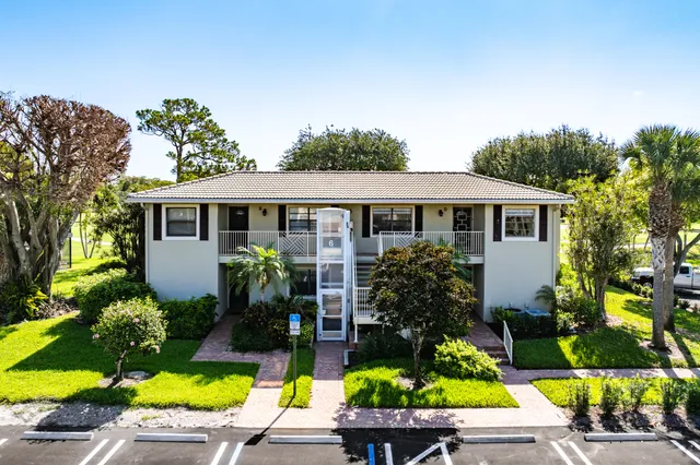a view of a swimming pool with sitting area