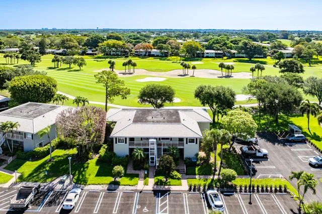 a view of a house with swimming pool and garden