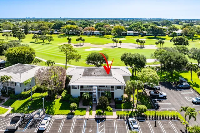 a dining room with furniture and a garden view