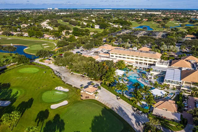 a view of a hall with dining area and chandelier