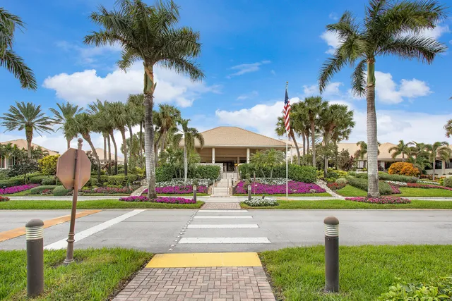 a group of people sitting outside of a building