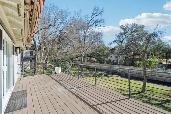 a view of a balcony with wooden floor