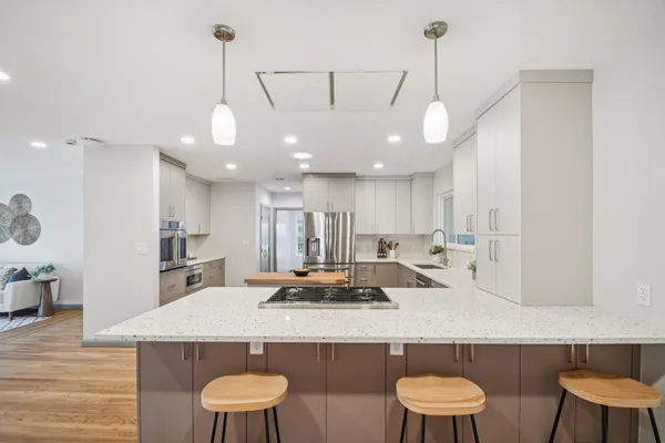 a kitchen with a table and chairs in it