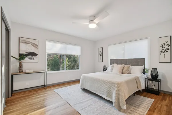 a bedroom with a large bed and a view of bedroom