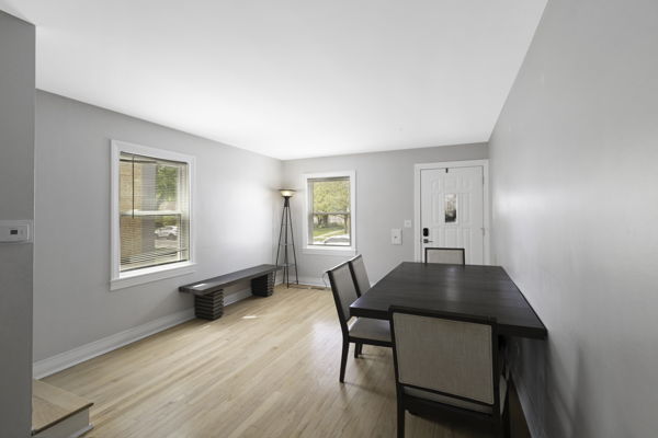 2623 North Rhodes Avenue River Grove, IL 60171 - Photo 2 of 17 a view of a dining room with furniture and wooden floor