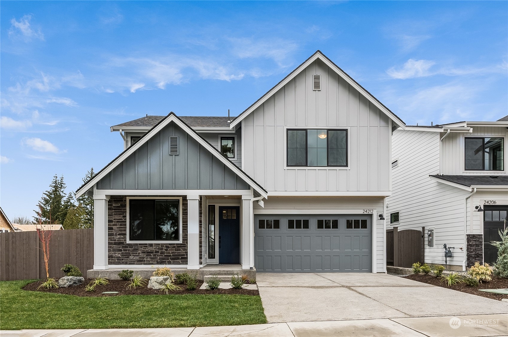 4439 244th Street Southeast Bothell, WA 98021 - Photo 1 of 29 a front view of a house with a yard and garage