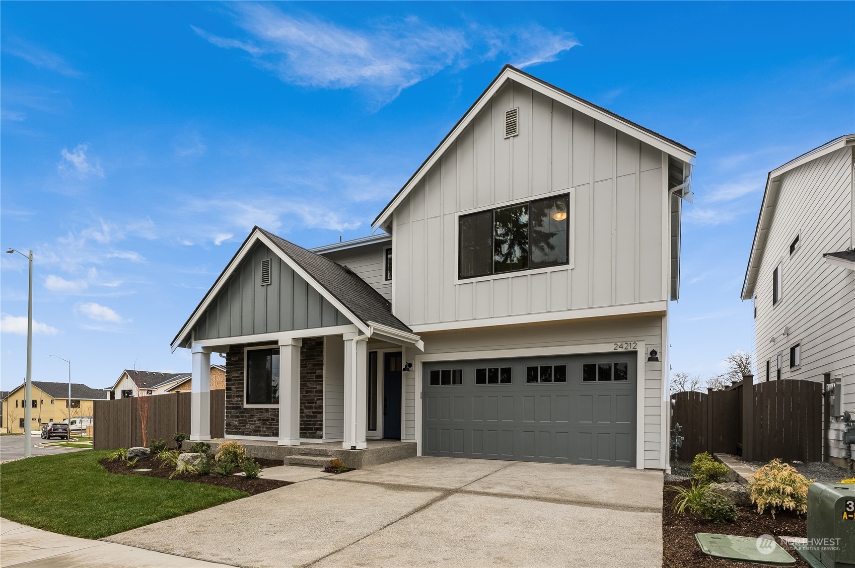 4439 244th Street Southeast Bothell, WA 98021 - Photo 2 of 29 a front view of a house with a yard