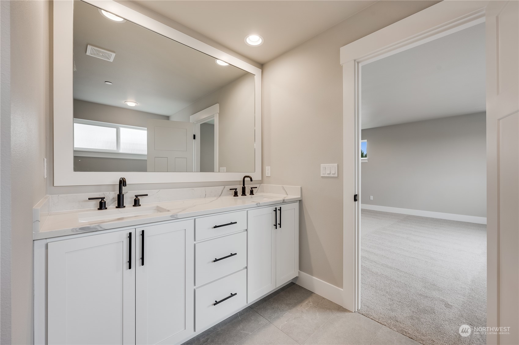 4439 244th Street Southeast Bothell, WA 98021 - Photo 23 of 29 a bathroom with a double vanity sink and mirror