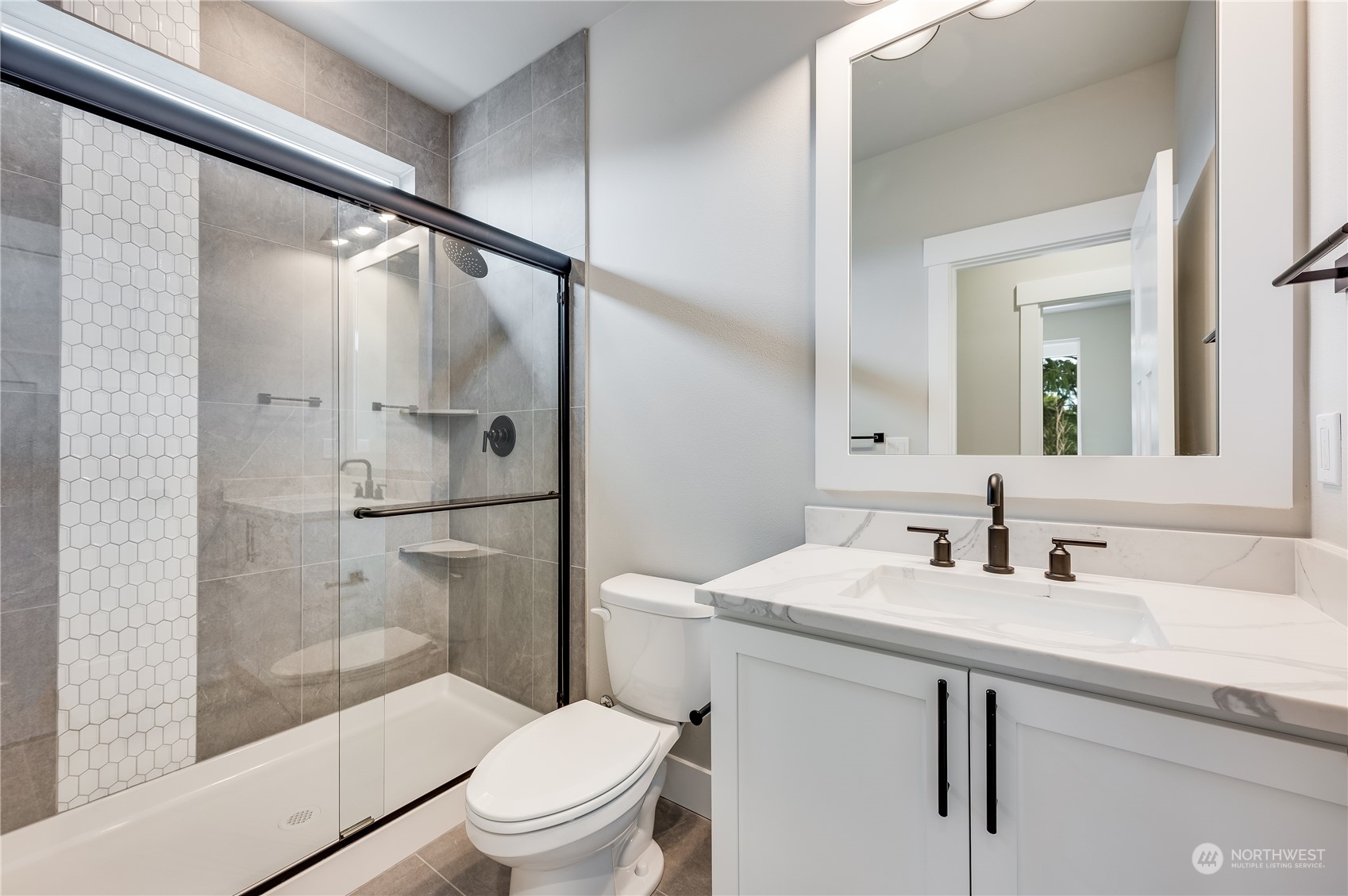 4439 244th Street Southeast Bothell, WA 98021 - Photo 7 of 29 a bathroom with a sink toilet and shower