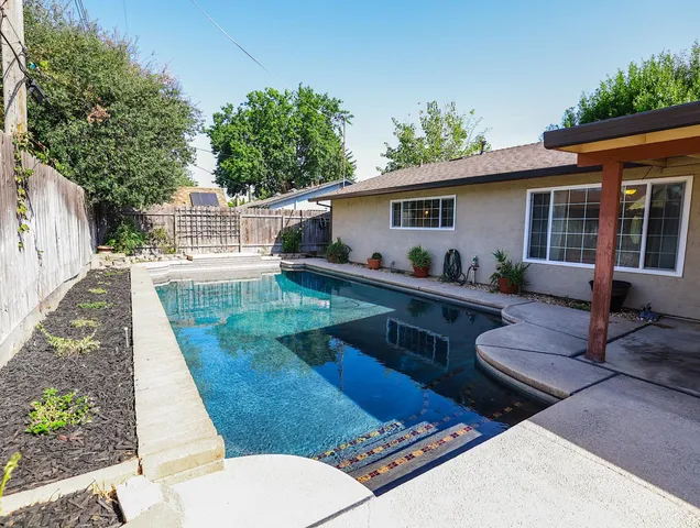 a view of a house with sitting area and furniture